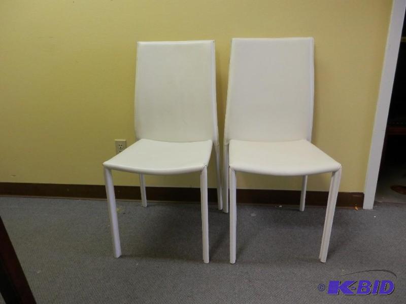 pair of thick white Leather chairs