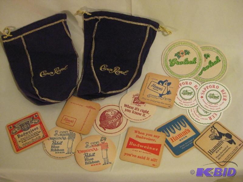 lot 8 image: Crown Royal Bags with Vintage Beer Coasters...
