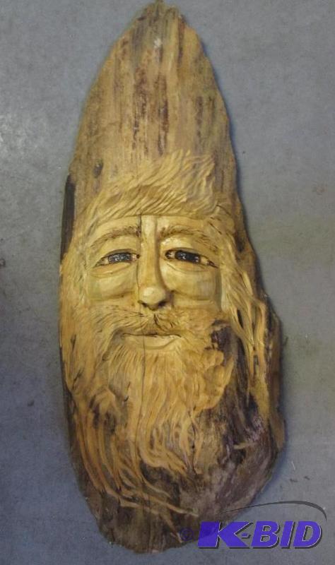 lot 23 image: wooden carved face of a man...