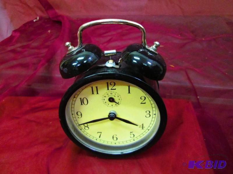 lot 73 image: Wind up alarm clock...
