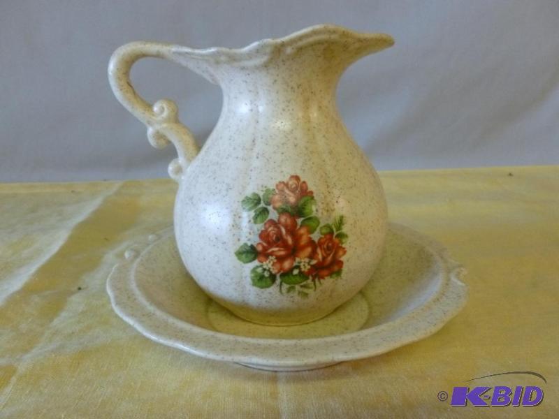 Small decorative porcelain wash basin and pit...