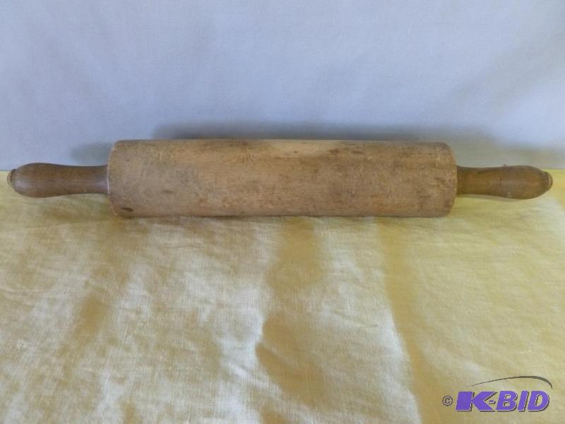 Vintage wooden rolling pin that measures 17 3...