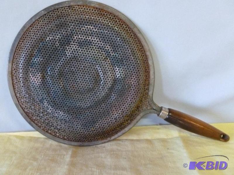 Vintage wood handled and metal hot pan holder...