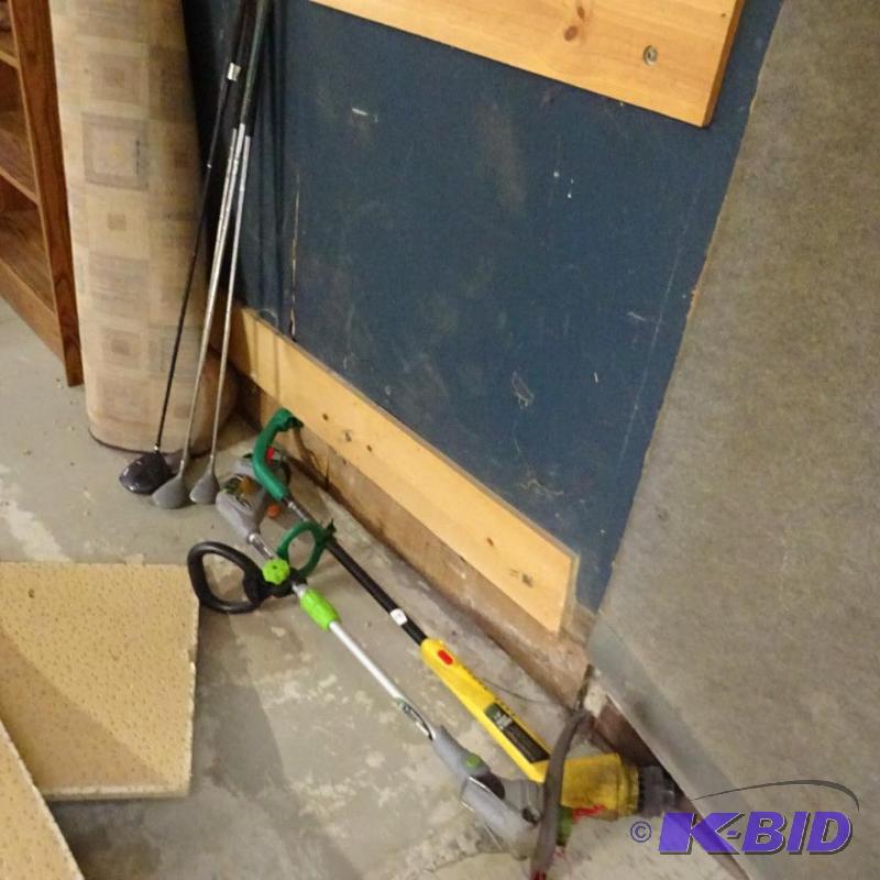 lot 72 image: Misc golf clubs. Earth wise 18 volt weed whip...