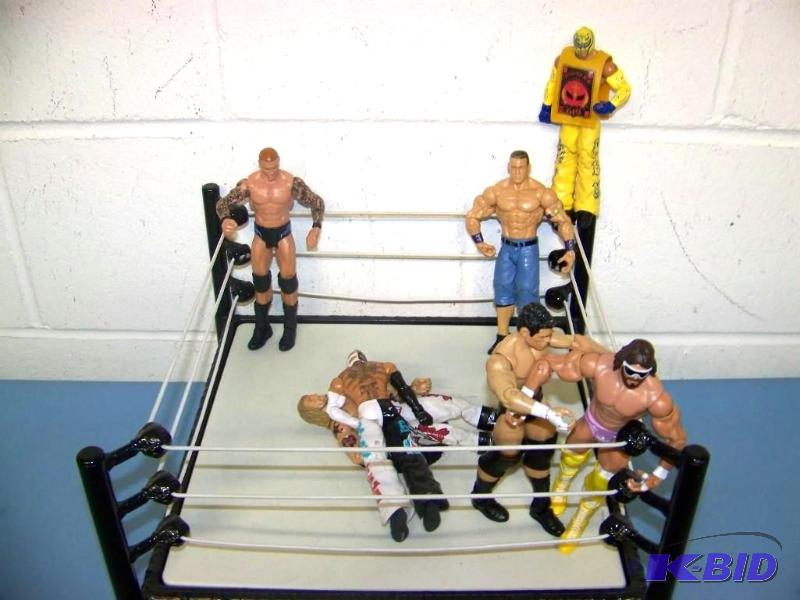 lot 14 image: WWE, Real Action Wrestling Ring and (7) WWE Superstars