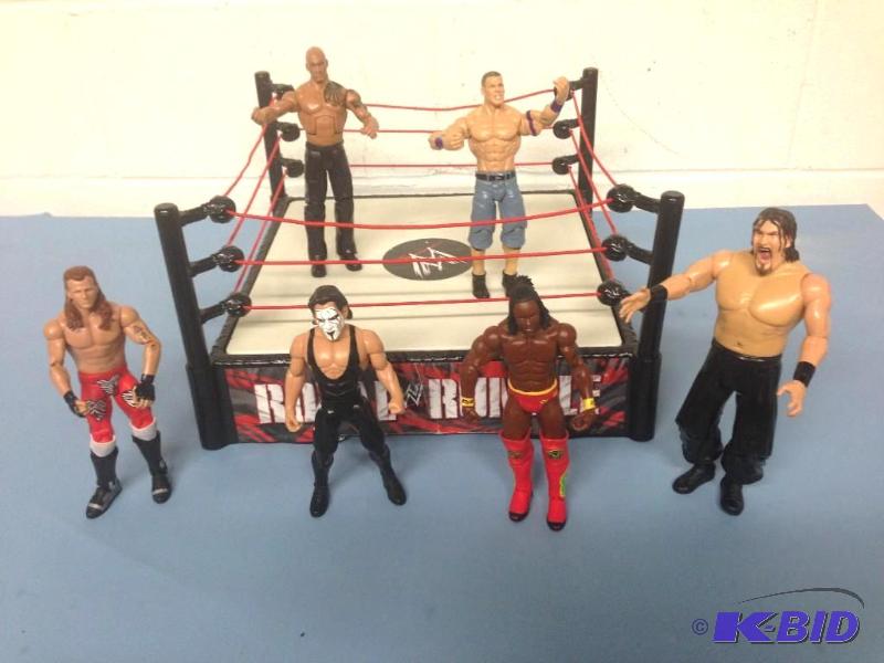 lot 16 image: Collectable Kids Toys - WWE Superstar Wrestling Action Figures and Ring
