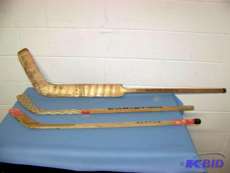 lot 32 image: (3) Vintage, Wood Hockey Sticks