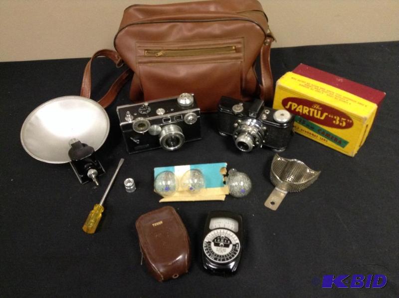 lot 64 image: Lot of Vintage Argus Range Finder 35 mm camera, Spartus 35 mm camera and accessories
