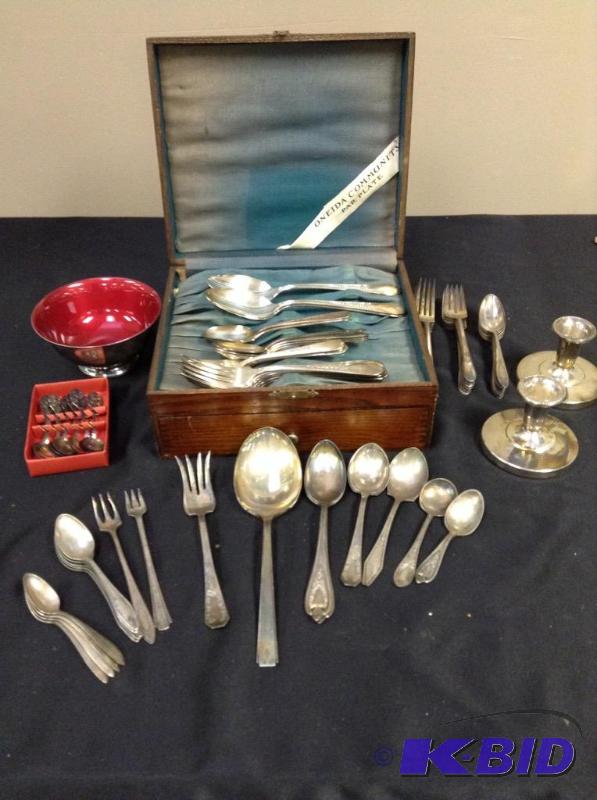 lot 82 image: Lot of vintage silver plate flatware, candle sticks, and bowl.