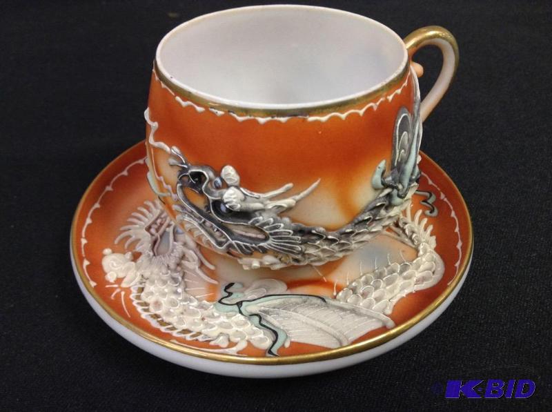 lot 95 image: Vintage lithopane cup and saucer with dragons.