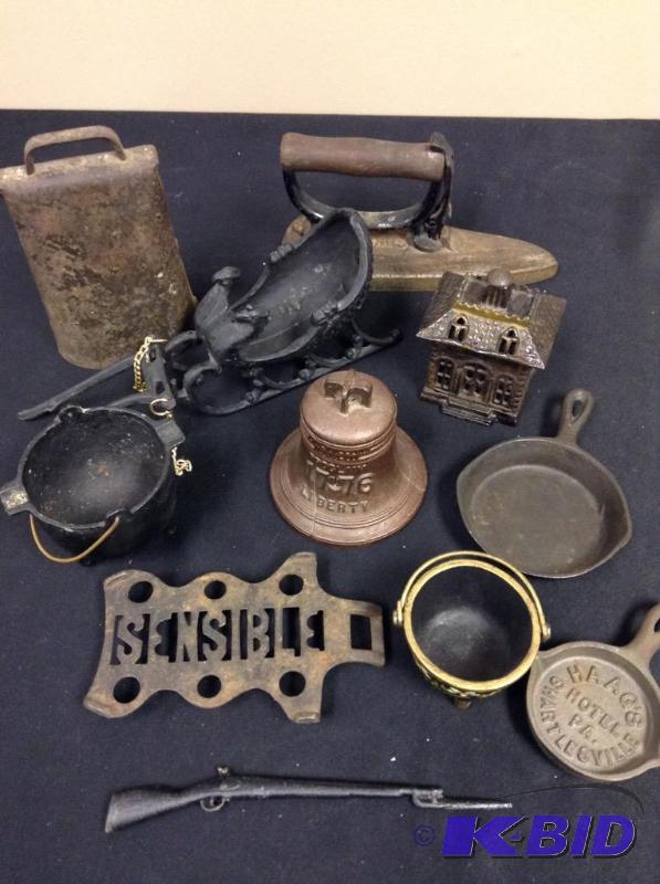 lot 114 image: Lot of vintage cast iron cow bell, iron, sleigh and miniature house