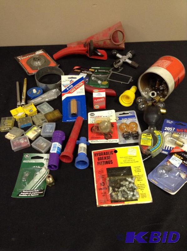 lot 156 image: Lot of automotive needs - bulb, fuses, filters, antifreeze tester, thermostat and more