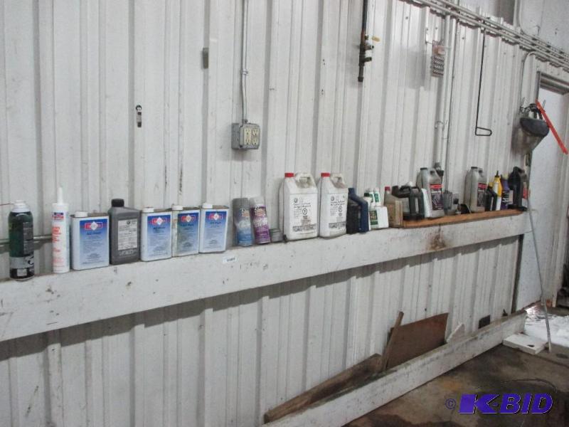 lot 43 image: Misc auto fluids on the wall...