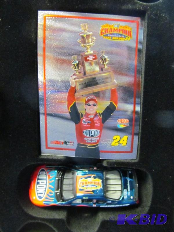 lot 24 image: 2001 Jeff Gordon #24 DuPont  Winston Cup Champion Card & 164 Diecast Car set in Collectors Tin 1 of 37,560