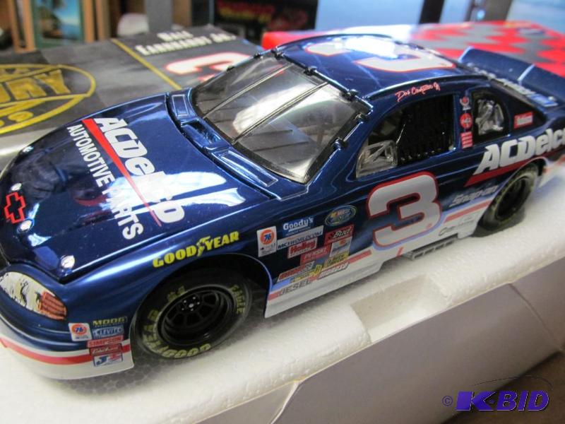 lot 7 image: 1999 Dale Earnhardt Jr #3 AC Delco Last Lap of the Century 124 Clear Window Bank 1 of 10,000 by Action