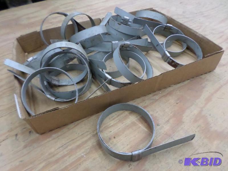 lot 94 image: Box Of Numerous 4" Hose Clamps...