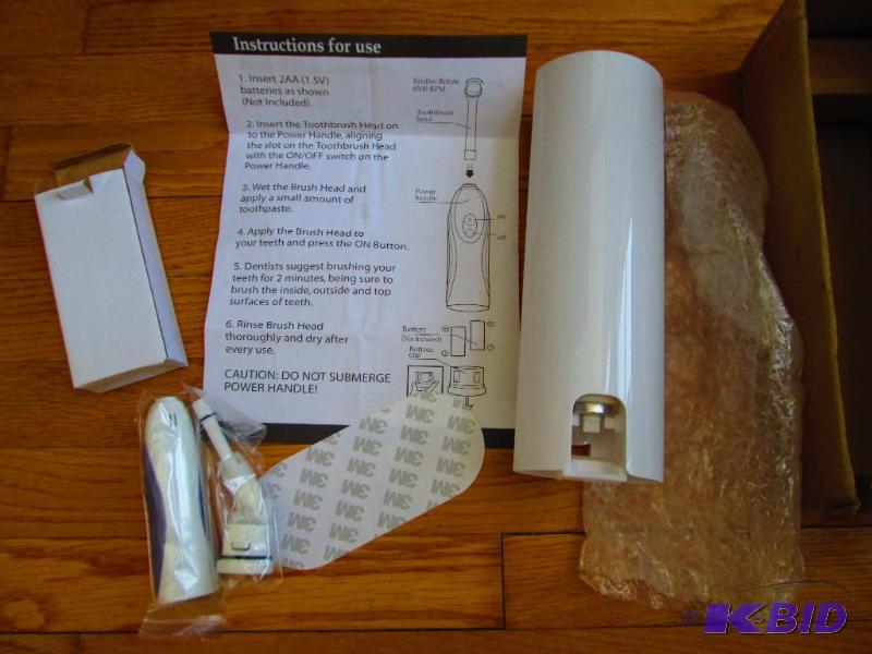 lot 26 image: Touch n Brush toothpaste dispenser and brush ...
