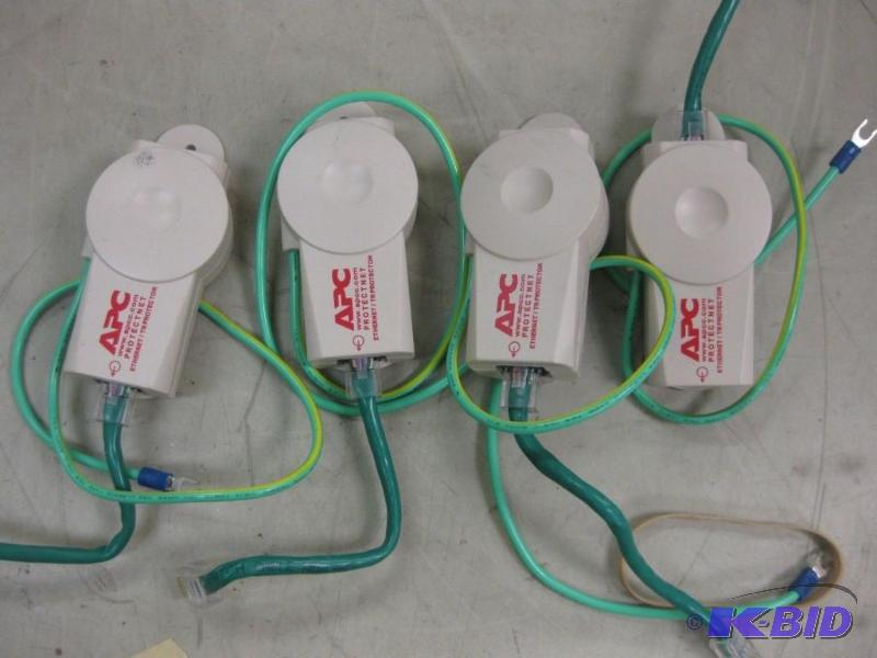 lot 25 image: Lot of (4) APC Standalone Gigabit Ethernet Su...