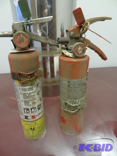 2 fully charged fire extinguishers...