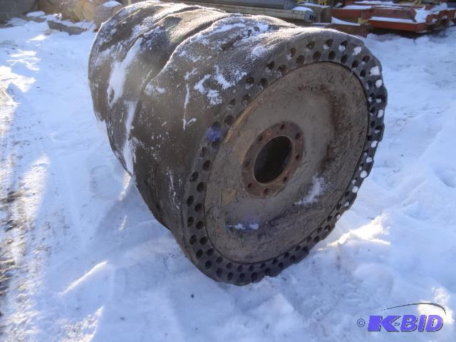 4 solid rubber tires and rims for skid loader...