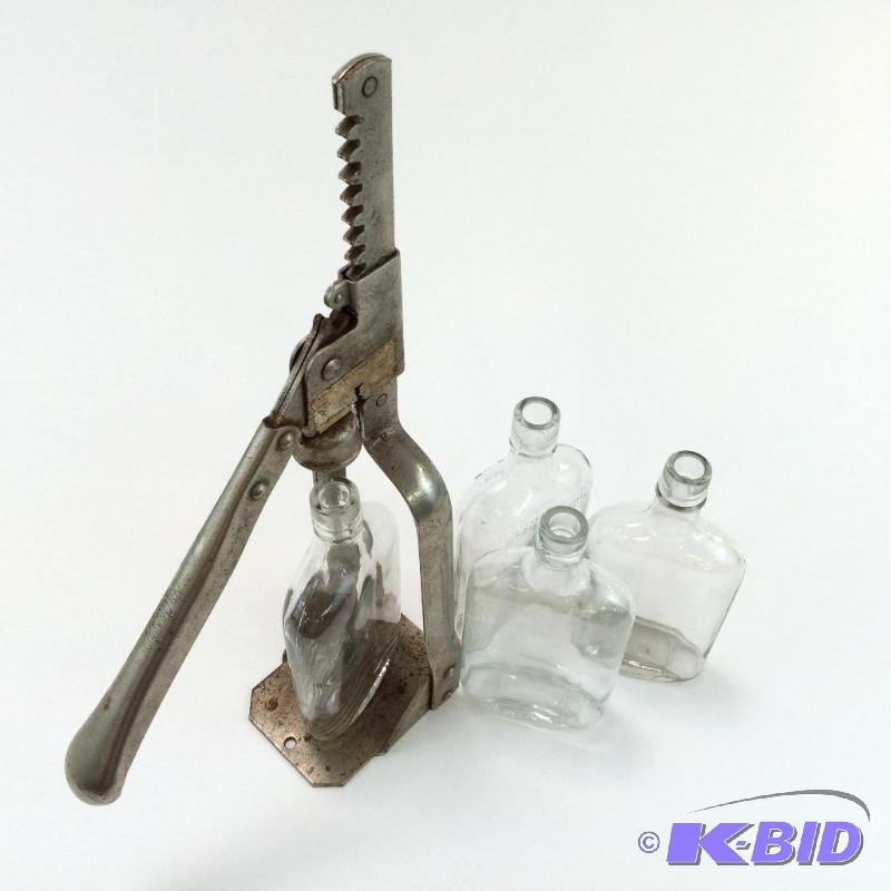 lot 17 image: Lot of 4 Prohibition Flask Bottles & Corker Machine from 1920s