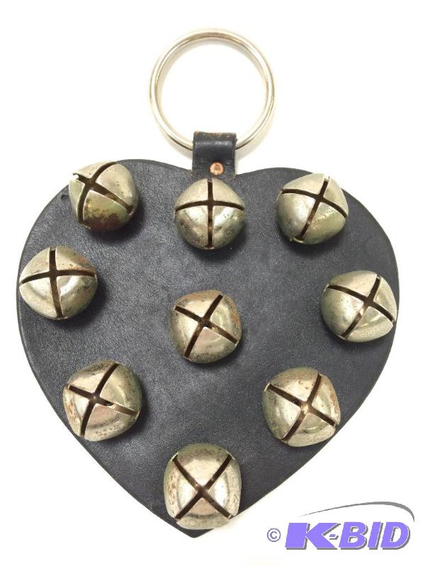lot 28 image: Old Sleigh Bells - Mounted on Leather Heart For Display