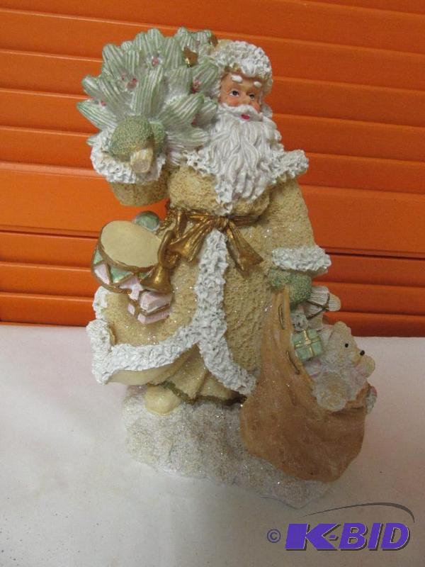 The Homemakers Idea Company Presents a Golden Santa with Tree