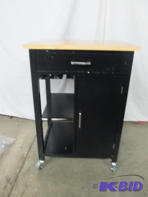 Add extra storage to your kitchen and a bit of extra counter space, too. This black-finished cart wi