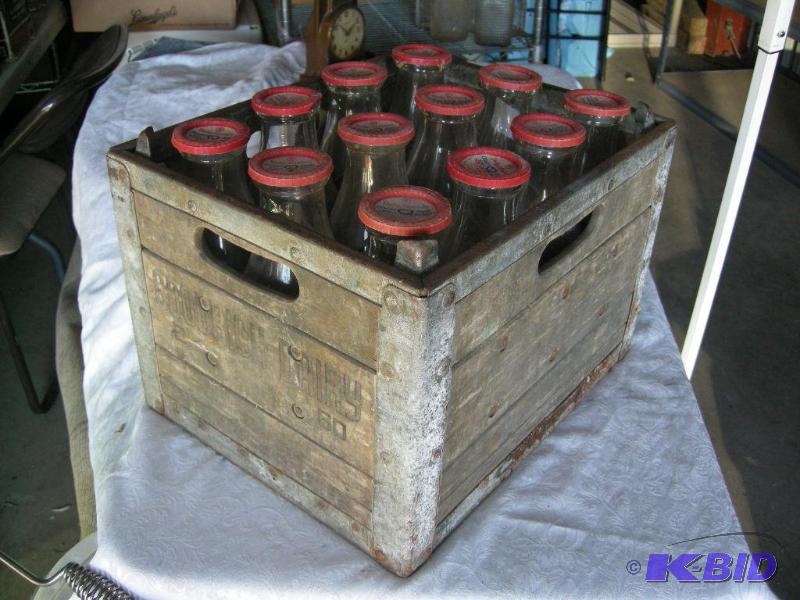 lot 54 image: Vintage milk crate & bottles