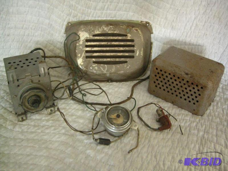 lot 99 image: Old Ford radio, speaker, gauge