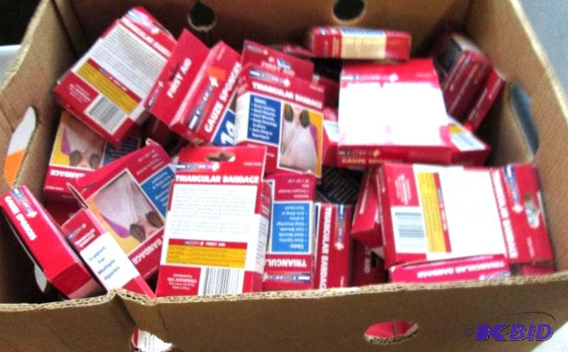 Large box of gauze sponges and triangular ban...