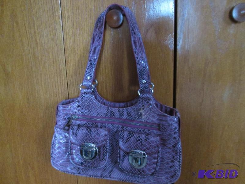 lot 18 image: pink aligator skin purse...