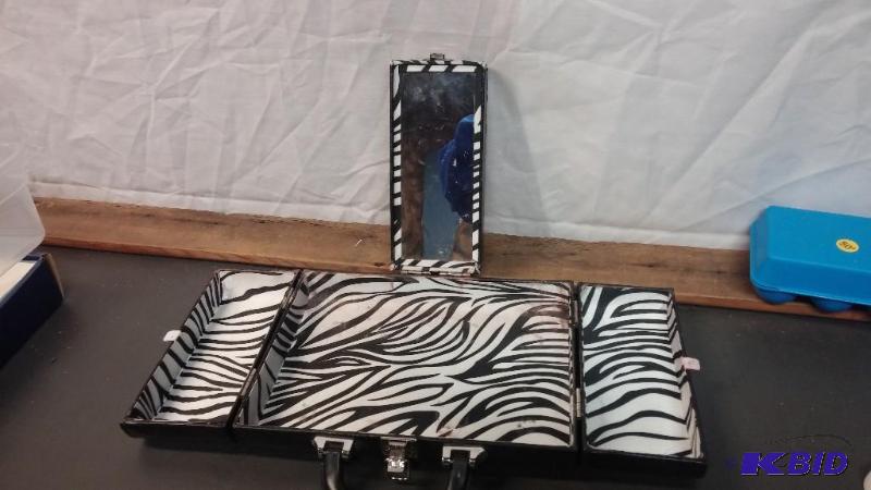 lot 30 image: Zebra Make Up Case...