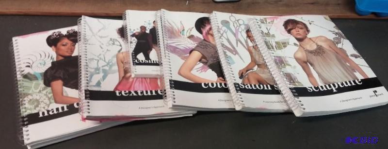 lot 7 image: Lot of Pivot Point Hair Design Books...