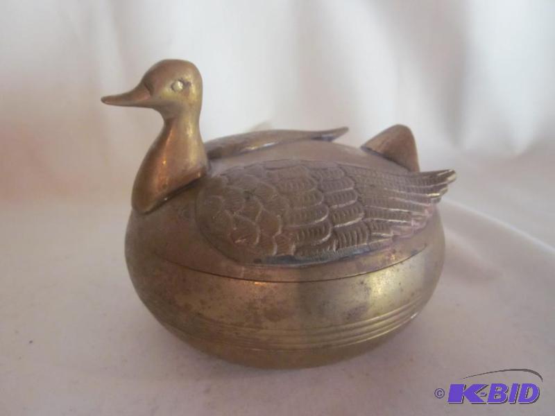 4 inch brass duck trinket dish....