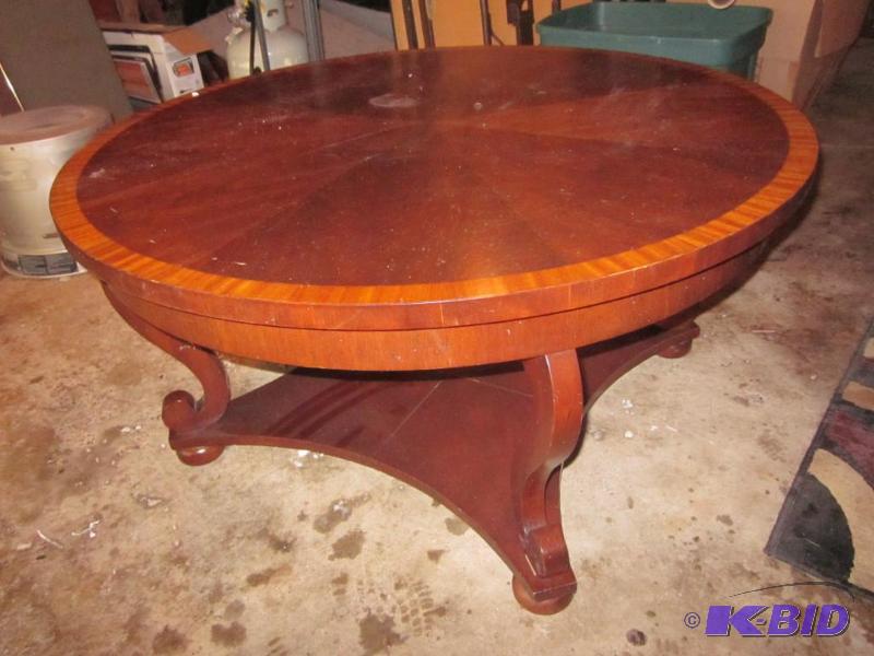 38 inch round solid wood coffee table with in...
