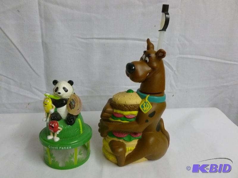 An M&M Panda Bank and Skooby Doo Drinking Cup
