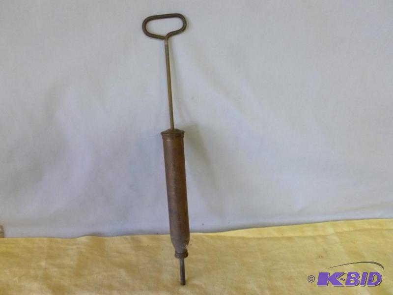 lot 116 image: Vintage brass hand pump greaser that measures...