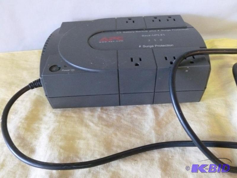 lot 75 image: Large APC battery backup with surge protectio...