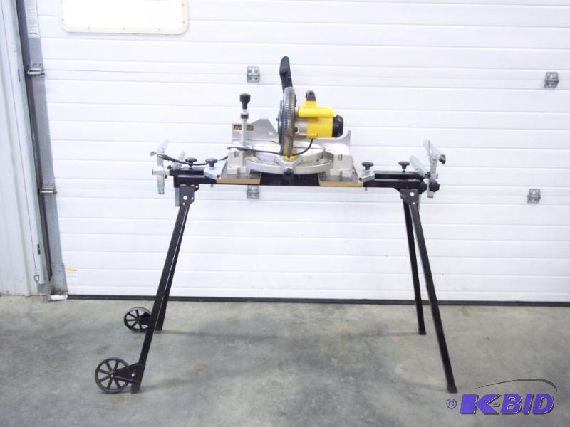 lot 13 image: Dewalt Model 703 miter saw with portable stan...