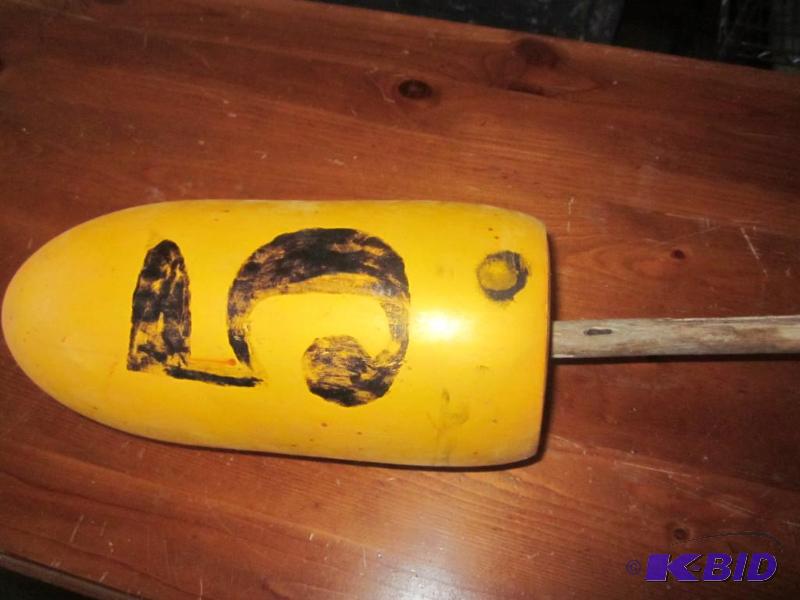 lot 104 image: Vintage yellow buoy on a natural stick. ...
