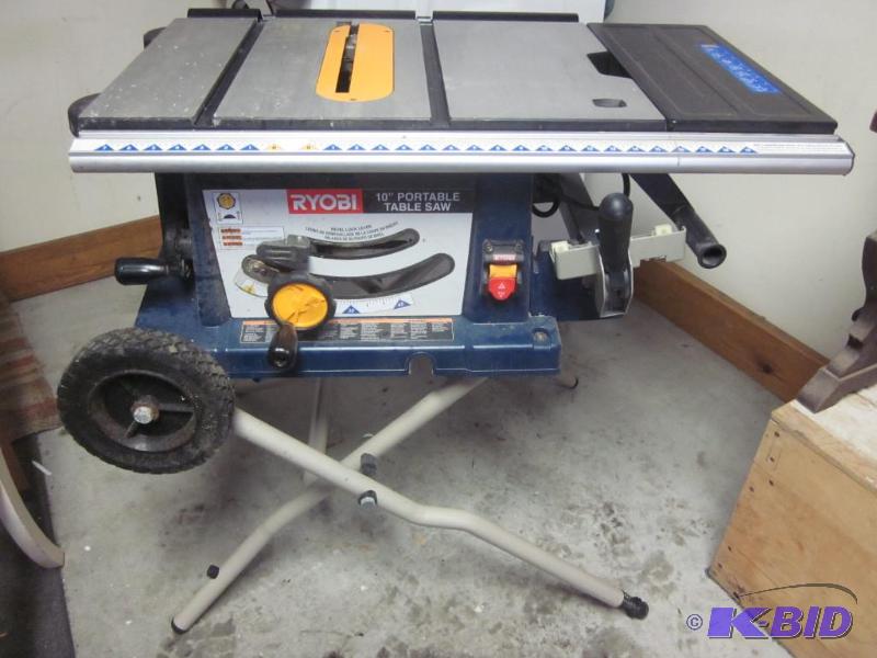 lot 18 image: Ryobi 10 inch portable table saw with stand a...
