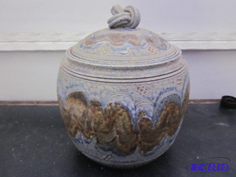 lot 70 image: 10 inch stoneware cookie jar with lid, signed...