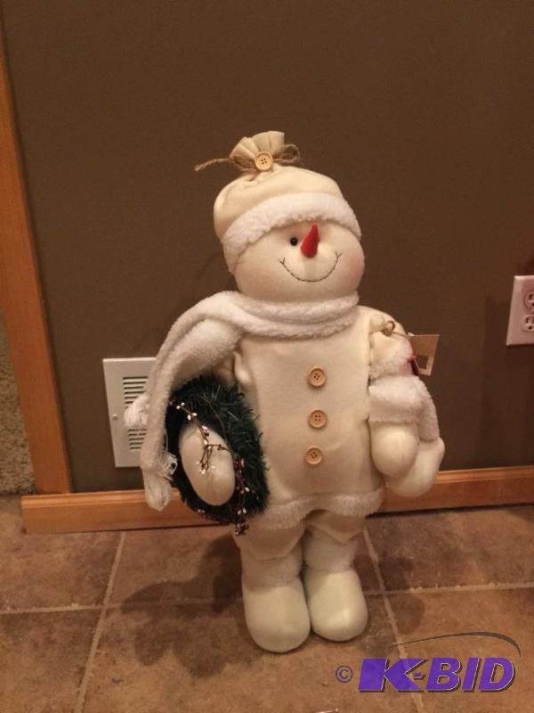 lot 11 image: Snowman with weighted feet great for entry wa...