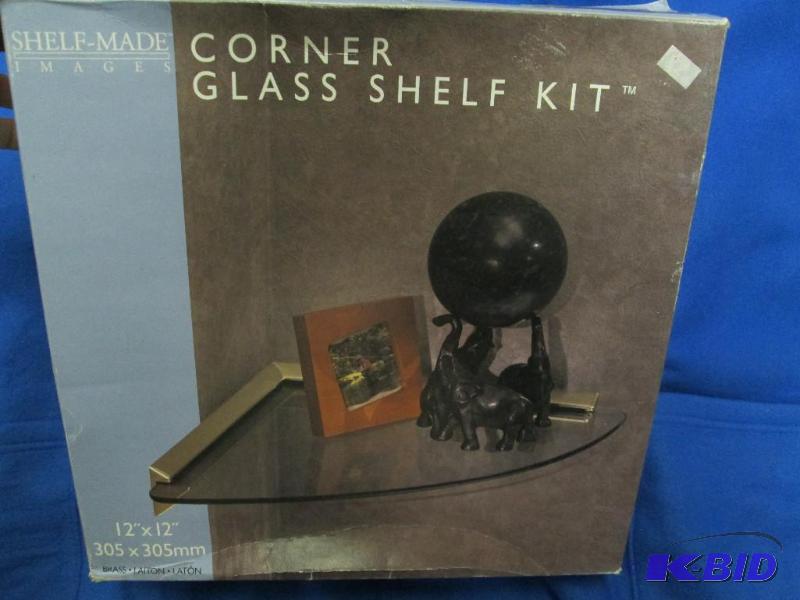 lot 32 image: Glass corner shelf with mounting hardware, 12...