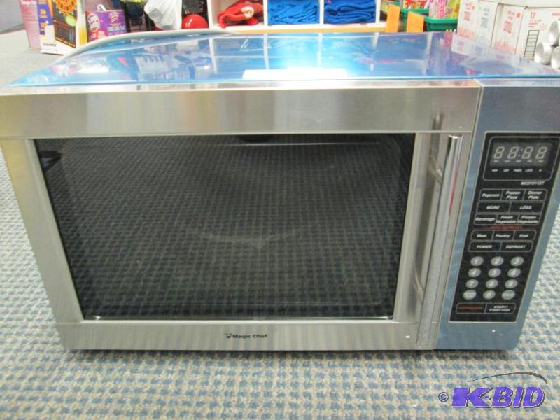 lot 64 image: Magic Chef MCD1311ST microwave, new. There is...
