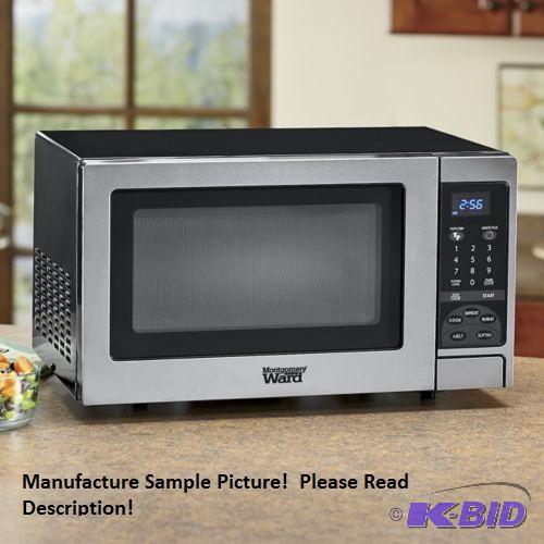 lot 31 image: Montgomery Wards 0.9 Cubic Foot Microwave Ove...