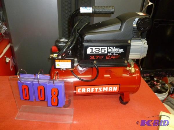 lot 8 image: Craftsman oil filled air compressor. Cast iro...