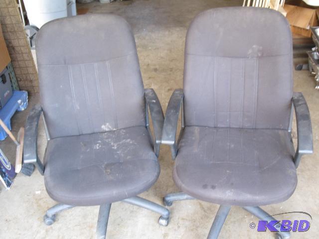 2 black office chairs, 1 missing a roller...