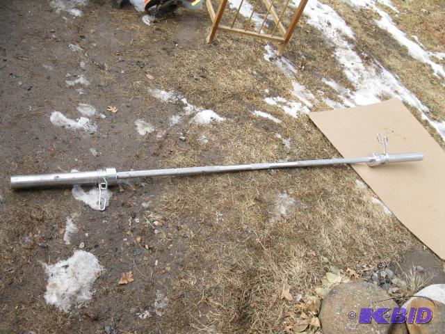 45 lb bar bell with clamps to hold the weight...